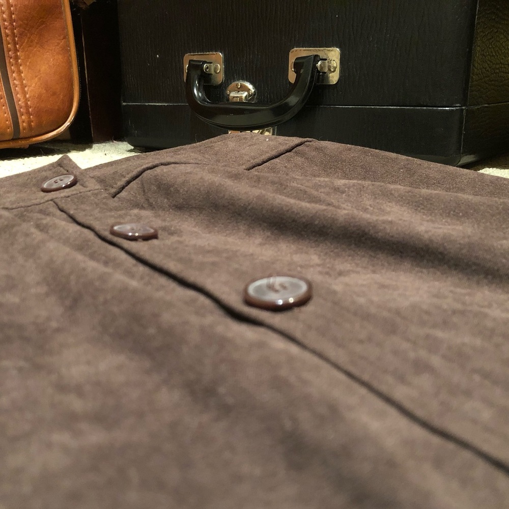 This is a high waisted brown to-the-ankle skirt.